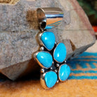 Sterling silver pendant with Kingman turquoise set in cluster bezels.