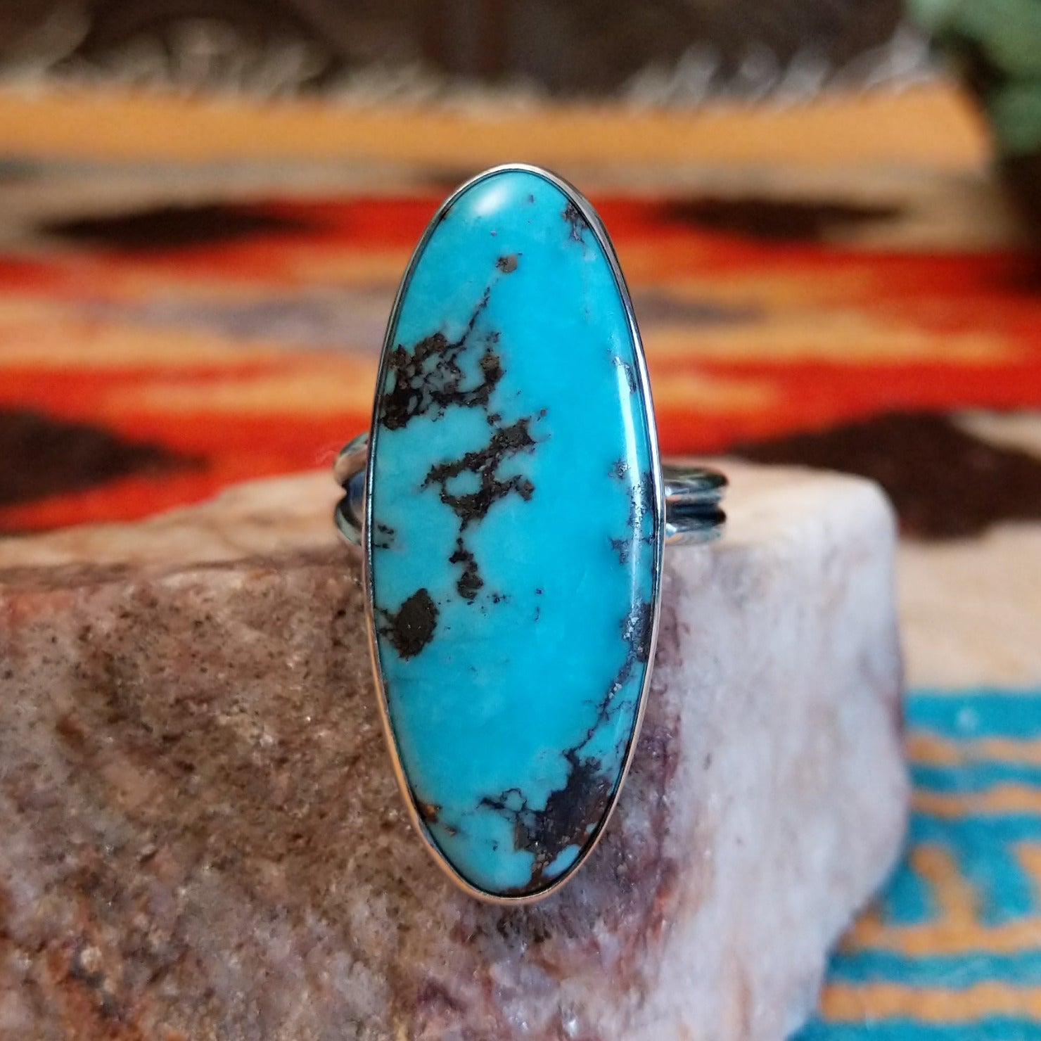 Sterling silver ring with Kingman turquoise set in the eclipse bezel.