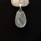 The artisan's signature is found on the sterling silver backing of the necklace. 