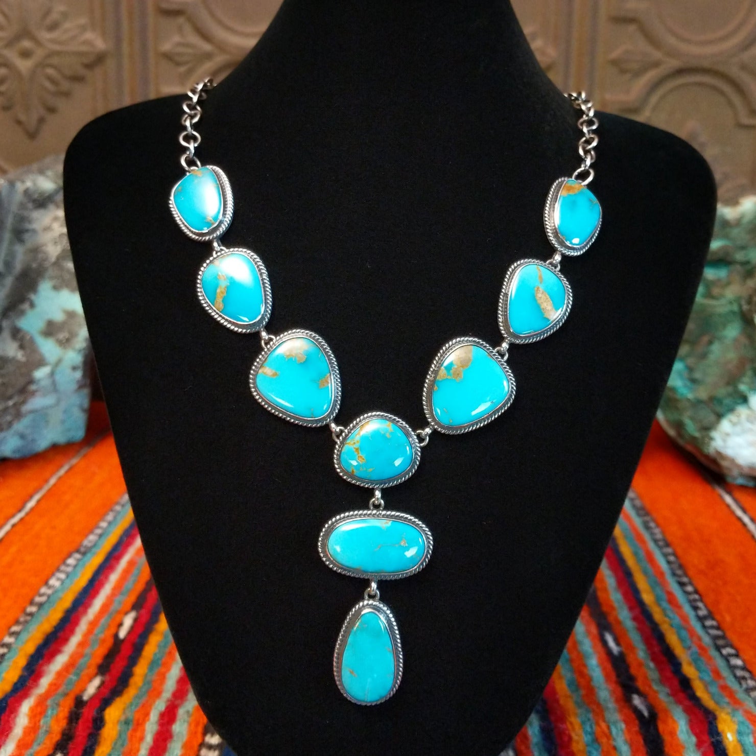 Kingman turquoise set in twisted rope bezels linked together to form the necklace.