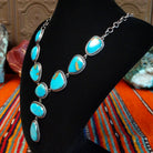Kingman turquoise set in twisted rope bezels linked together to form the necklace.