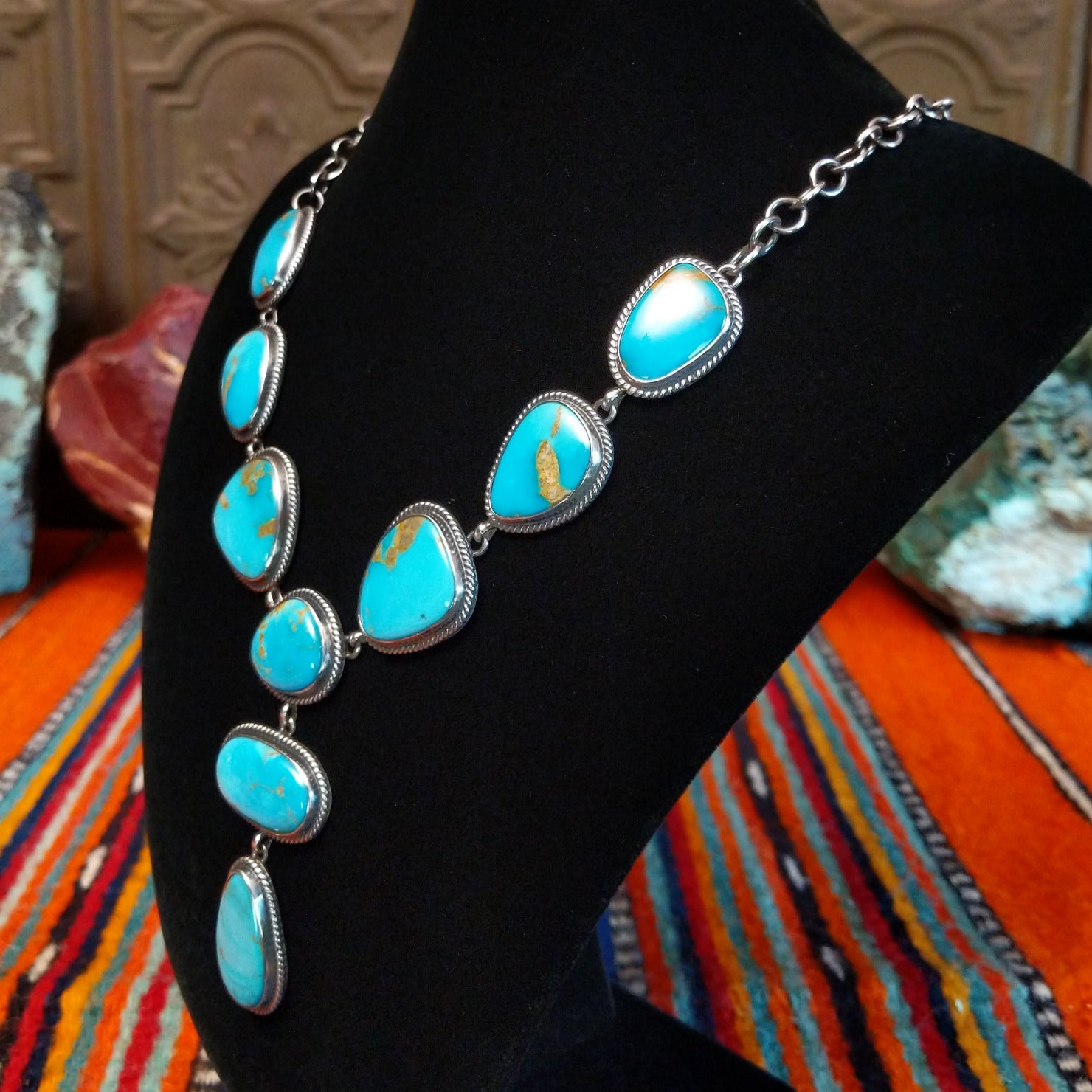Kingman turquoise set in twisted rope bezels linked together to form the necklace.