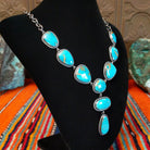 Kingman turquoise set in twisted rope bezels linked together to form the necklace.