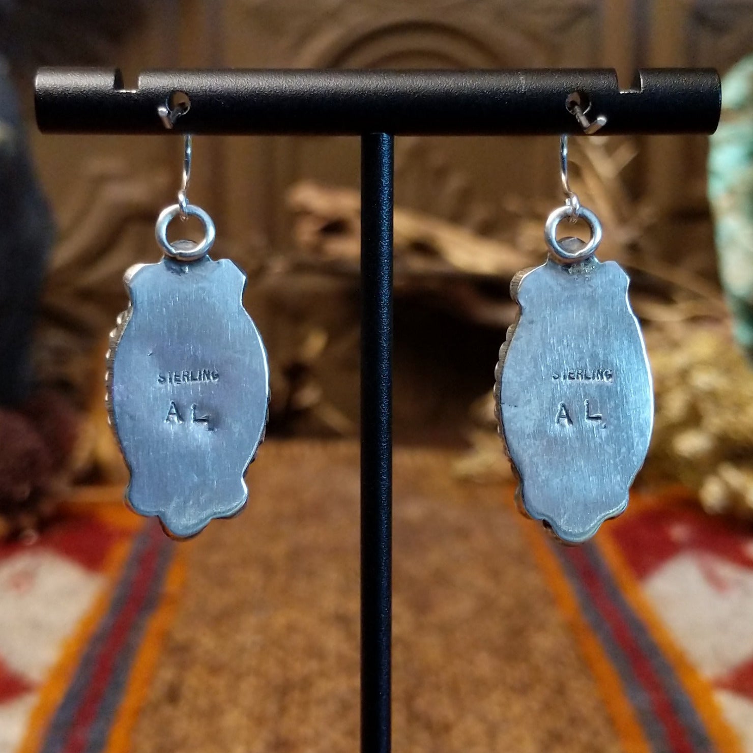 Close-up of the artisan's stamped initials.