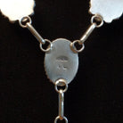 Close-up of the artisan's stamped initials.