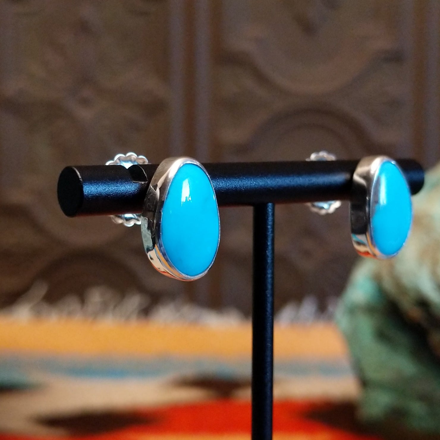 Sterling silver earrings with Kingman turquoise set in the oblong bezels.