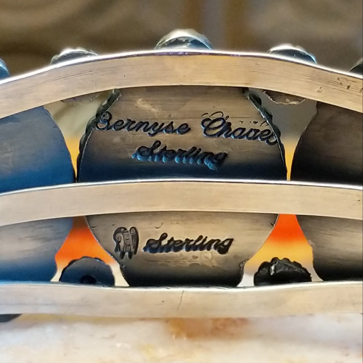Close-up of the artisan's stamped signature.