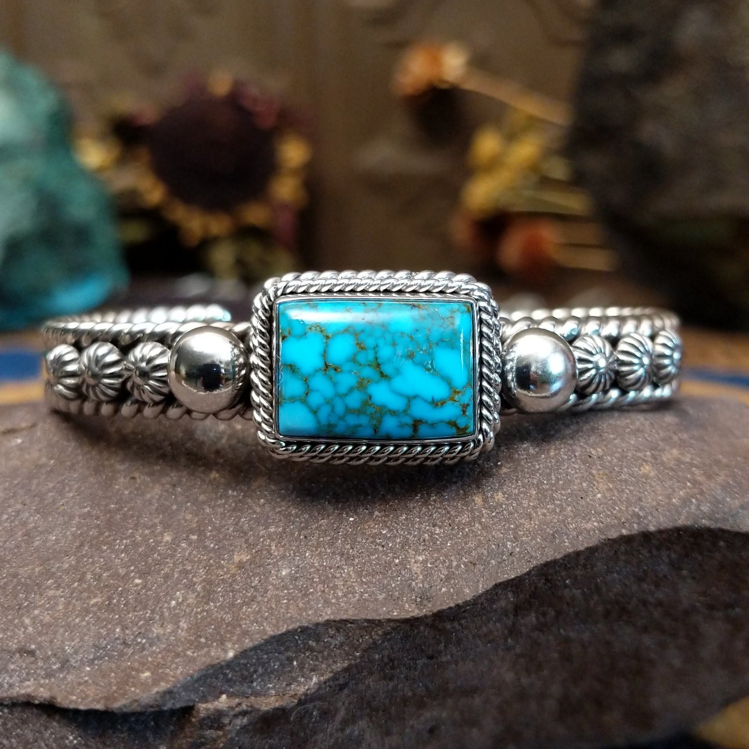 Sterling silver cuff featuring Kingman turquoise and twisted rope accents.