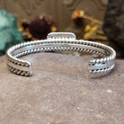 Sterling silver cuff featuring Kingman turquoise and twisted rope accents.