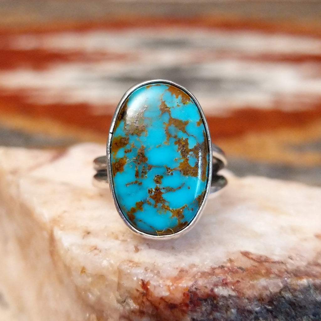 Sterling silver ring with kingman turquoise set in the oval bezel.