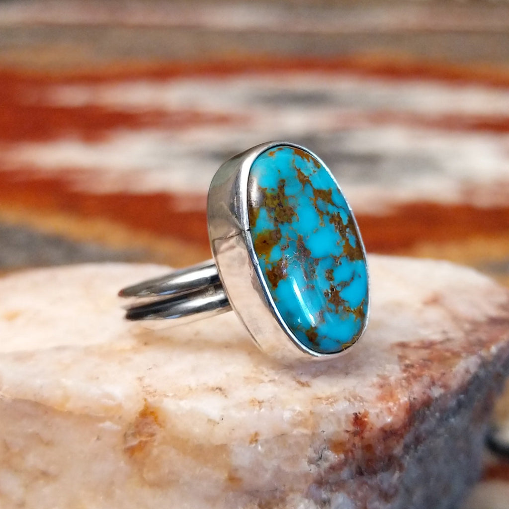 Sterling silver ring with kingman turquoise set in the oval bezel.