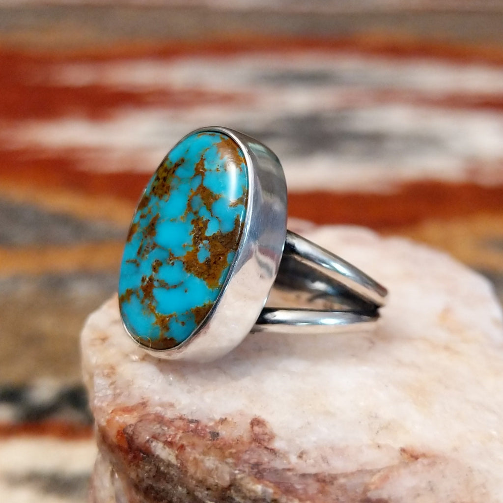 Sterling silver ring with kingman turquoise set in the oval bezel.