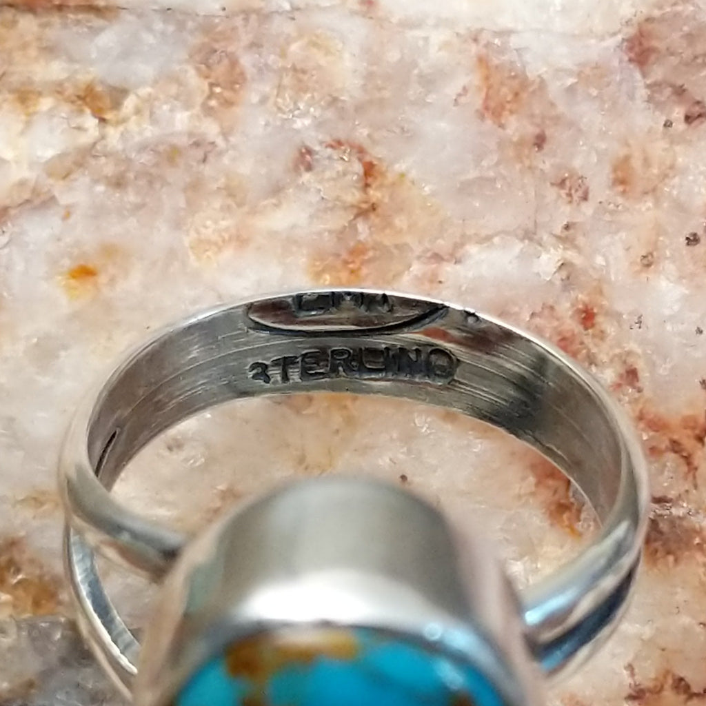 Close-up of the artisan's stamp on the interior of the band.