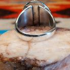 Sterling silver ring with Kingman turquoise set in the round bezel, framed by twisted rope detailing.