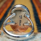 Kingman Turquoise Shadowbox Ring featuring a large oval blue turquoise stone with natural matrix, set in sterling silver with an oxidized shadowbox setting, notched border, and split-shank band; artisan and Sterling Silver stamp.