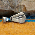 Close-up of the artisan's stamped signature.