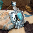 Sterling silver thunderbird pendant with Kingman turquoise set in a bezel.