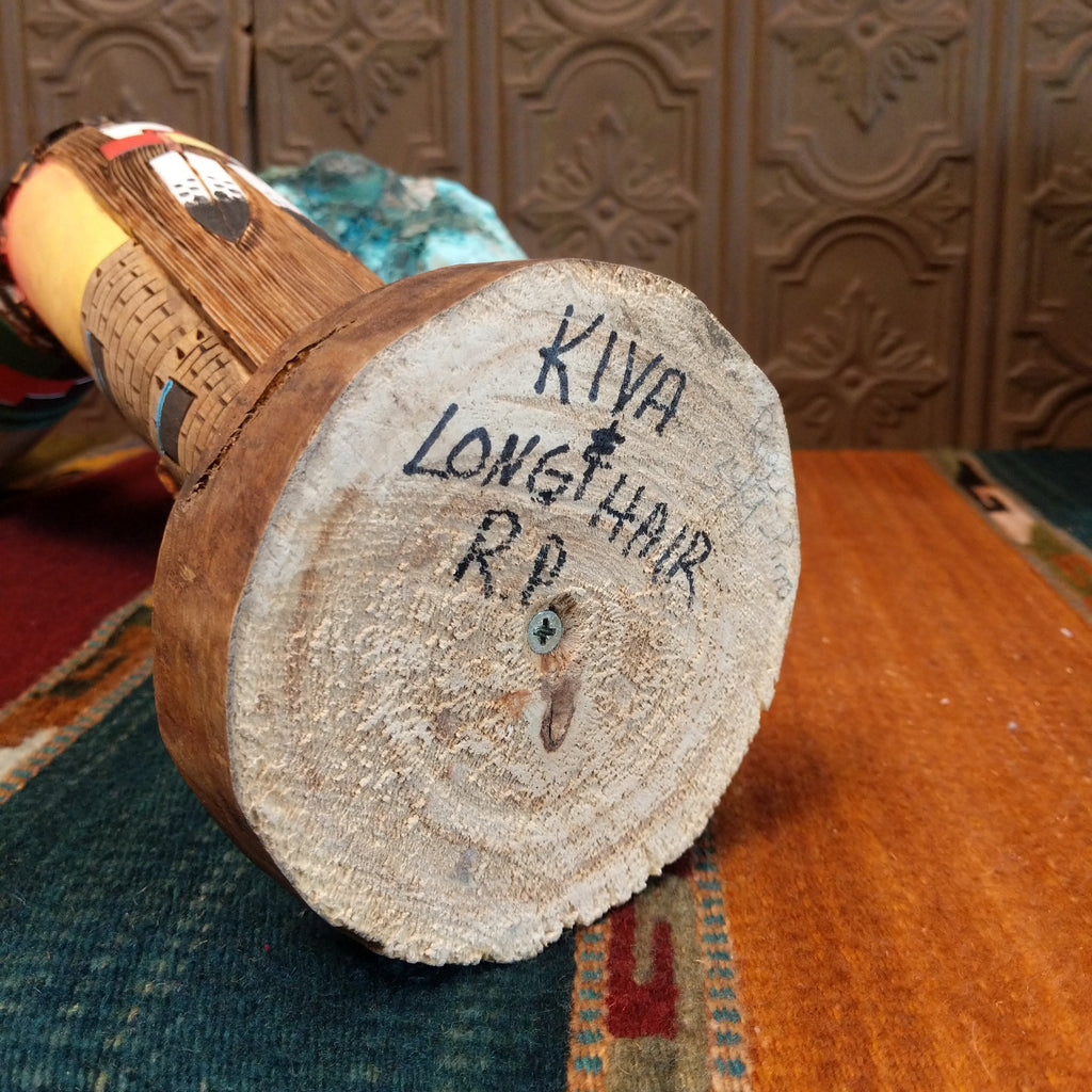 The artisan's signature is found on the base.