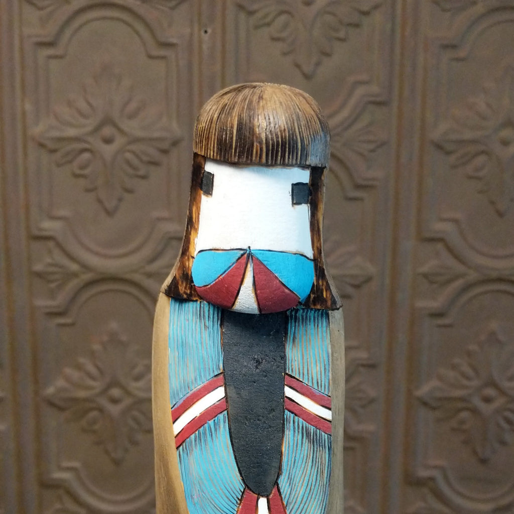 A close-up of the carved Shalako kachina face.
