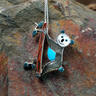 Handcrafted sterling silver koala pin and pendant by Valerie Comozona, featuring detailed inlay and a convertible pin-to-pendant design.