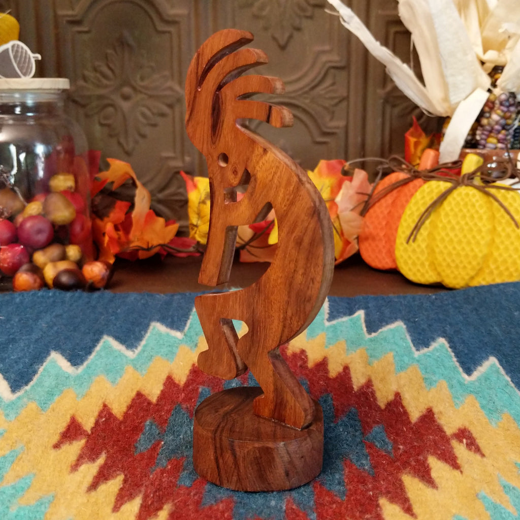 Ironwood carved into a detailed kokopelli figure.