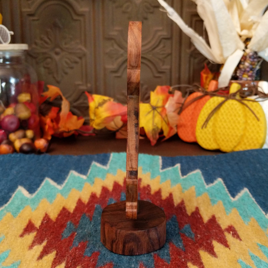 Ironwood carved into a detailed kokopelli figure.