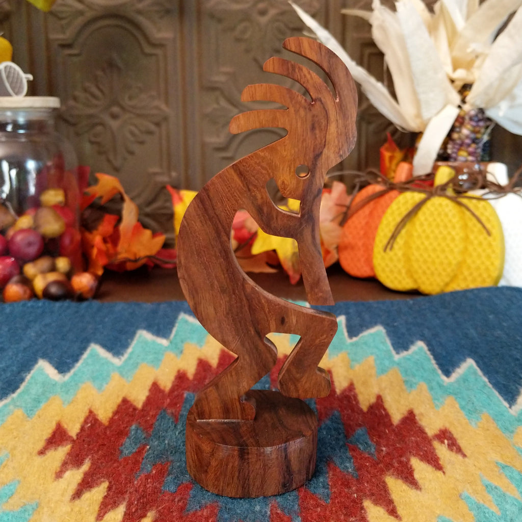 Ironwood carved into a detailed kokopelli figure.