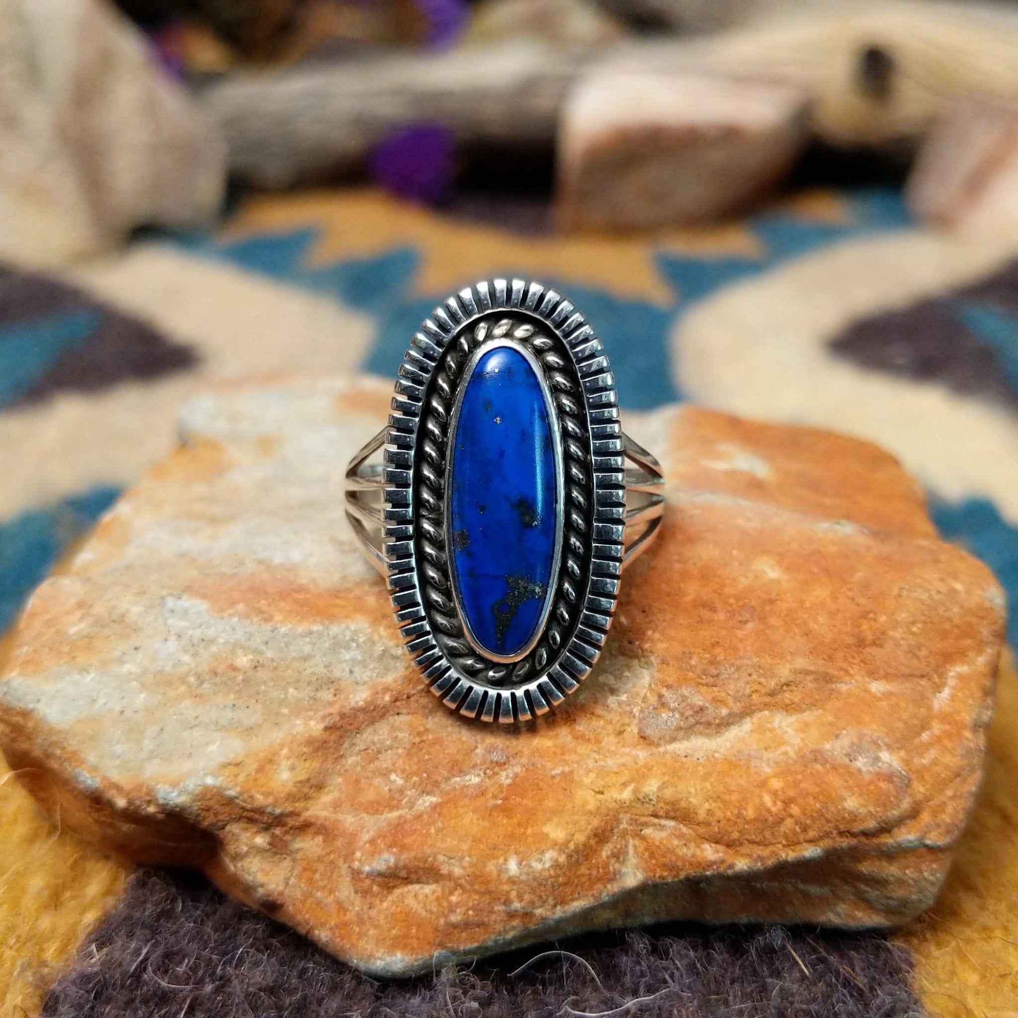 Sterling silver Lapis Lazuli ring by Tim Bedah featuring a capsule-shaped deep blue stone with natural pyrite inclusions.
