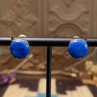 Sterling silver earrings with lapis set in round bezels.