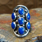 Sterling silver ring with lapis set in clustered bezels.