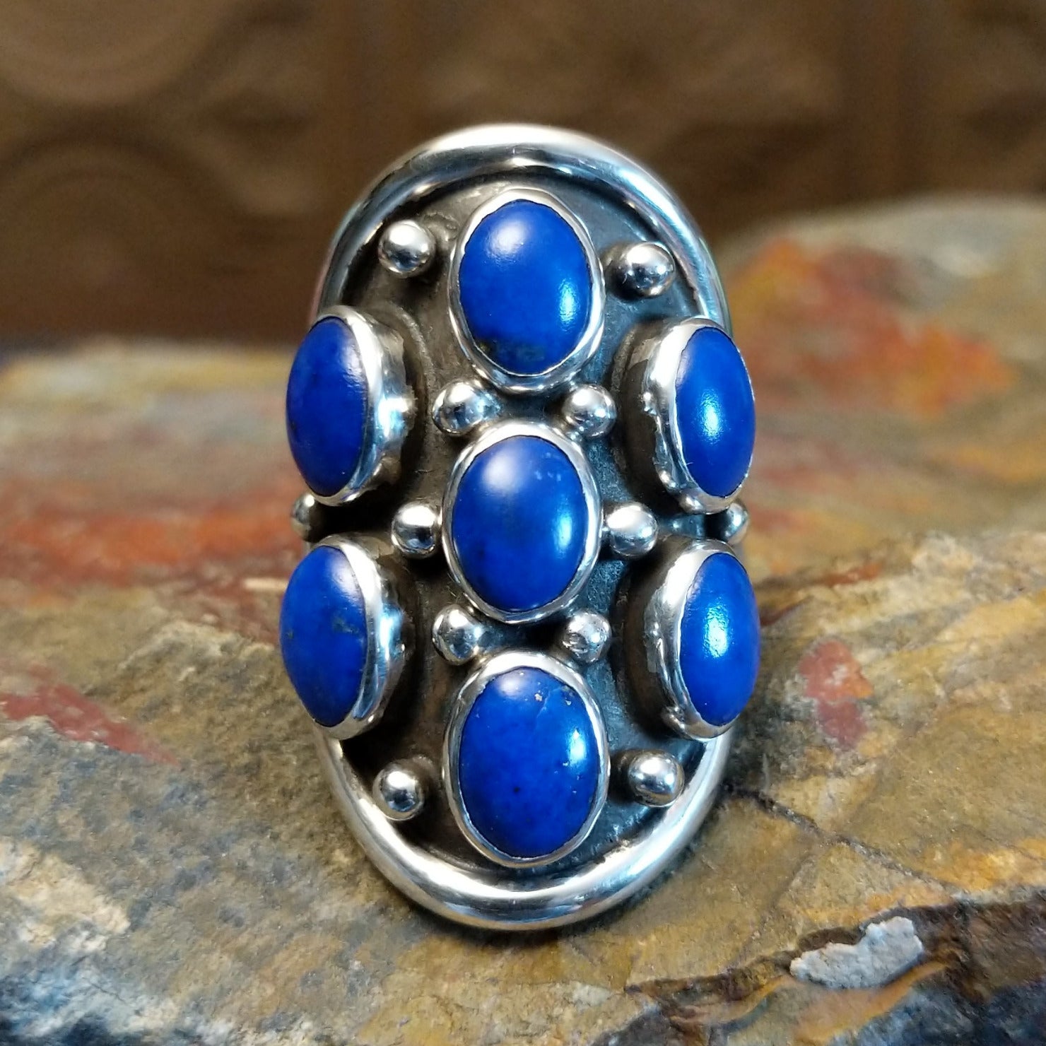 Sterling silver ring with lapis set in clustered bezels.