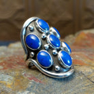 Sterling silver ring with lapis set in clustered bezels.
