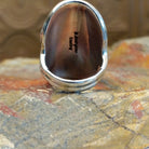 Sterling silver ring with lapis set in clustered bezels.