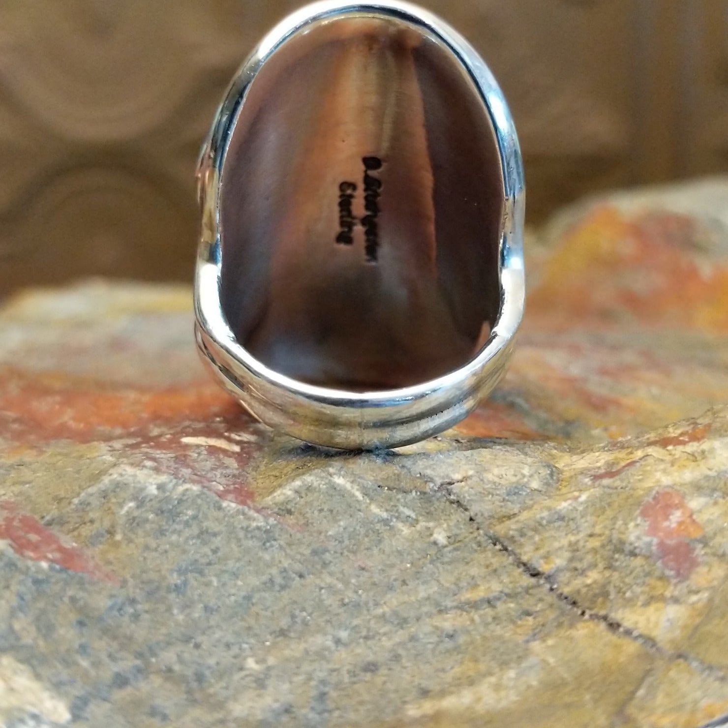 Sterling silver ring with lapis set in clustered bezels.