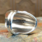 Close-up of the artisan's stamped signature.