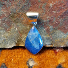 Sterling silver deltoid pendant with turquoise set in the bezel.
