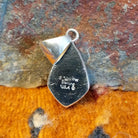 Close-up of the artisan's stamped signature.