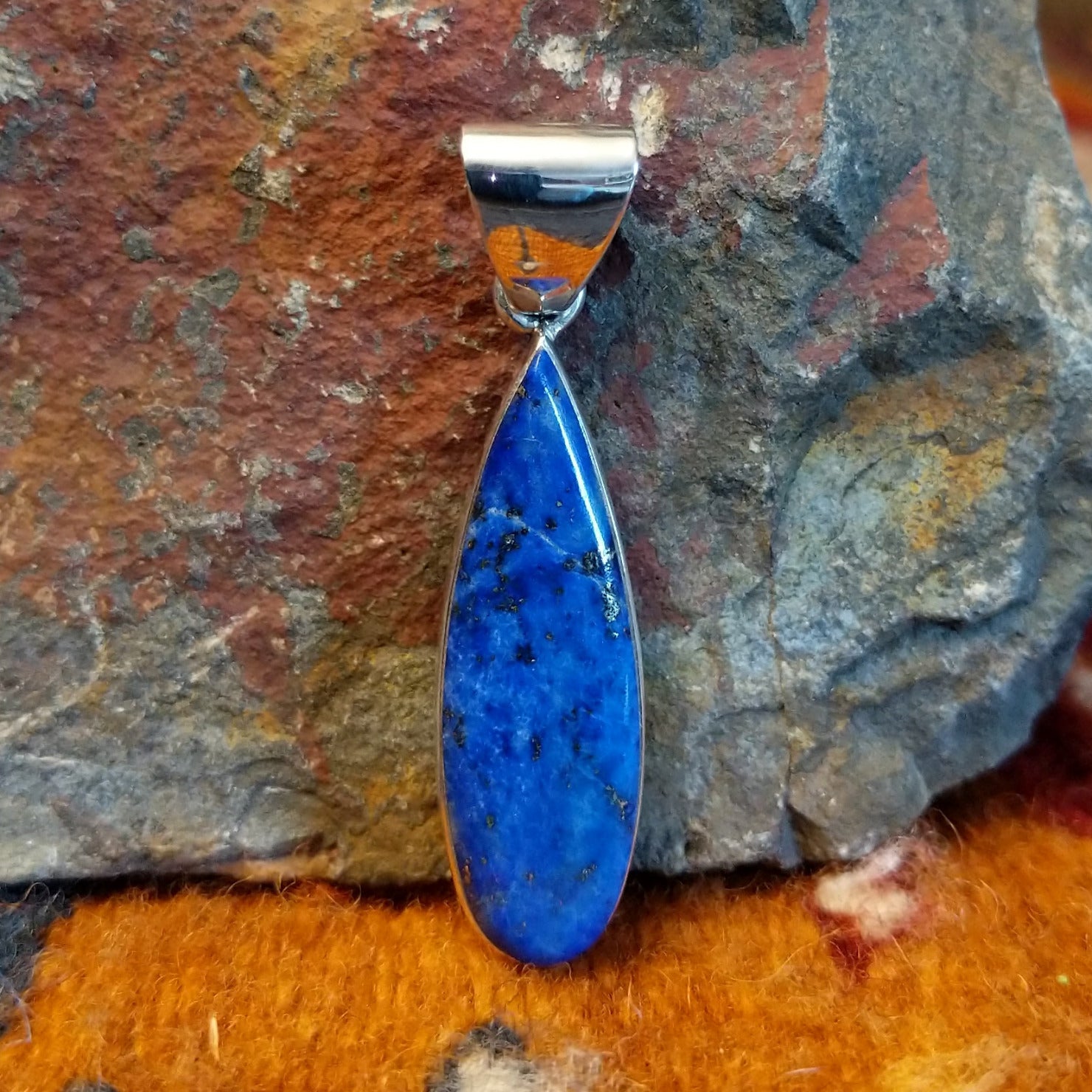 Sterling silver teardrop pendant with lapis set in the bezel.
