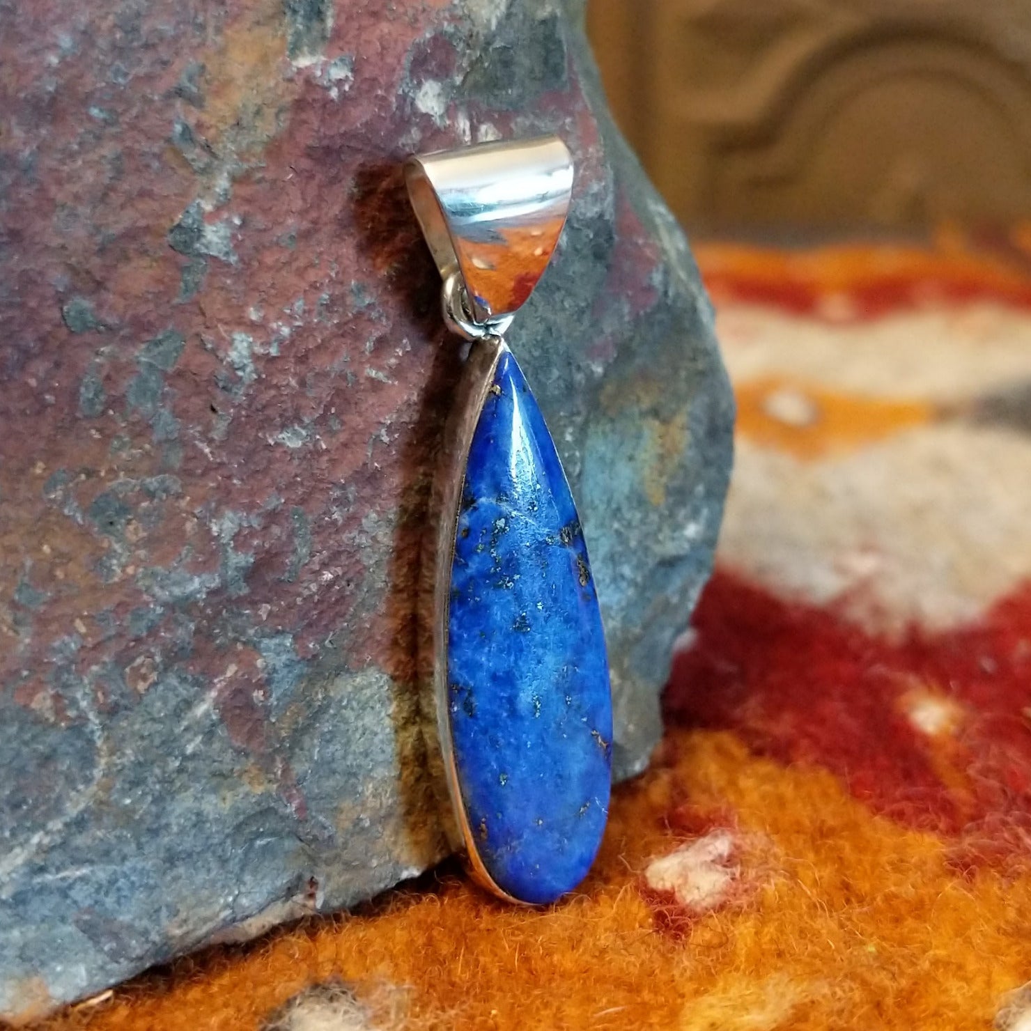 Sterling silver teardrop pendant with lapis set in the bezel.