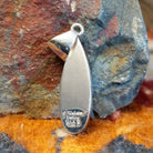 Close-up of the artisan's stamped signature. 