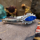 Sterling silver cuff featuring a navette-shaped lapis stone with silver beadwork and twisted rope detailing.