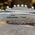 Close up of the artist's stamped signature.