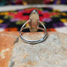 Vibrant Lapis Ring by Cathy Webster featuring an elongated royal-blue lapis stone with natural matrix set vertically in sterling silver with an open split-shank band; underside view.