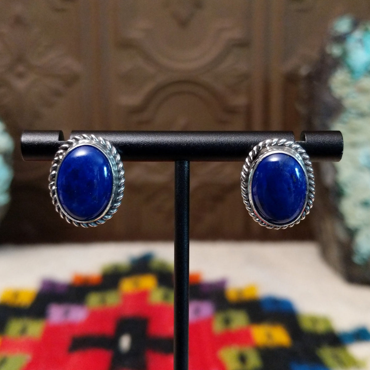 Lapis Oval Earrings by Priscilla Smith featuring deep blue oval lapis cabochons set in polished silver with twisted rope-style borders.