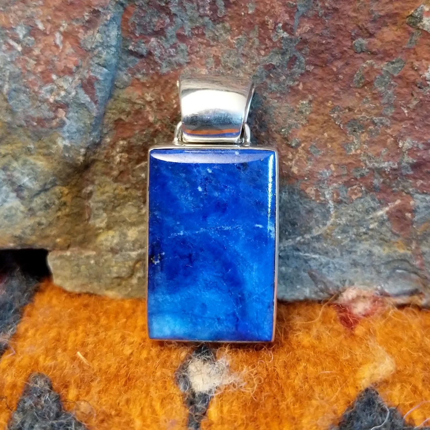 Rectangular sterling silver pendant with lapis set in the bezel.
