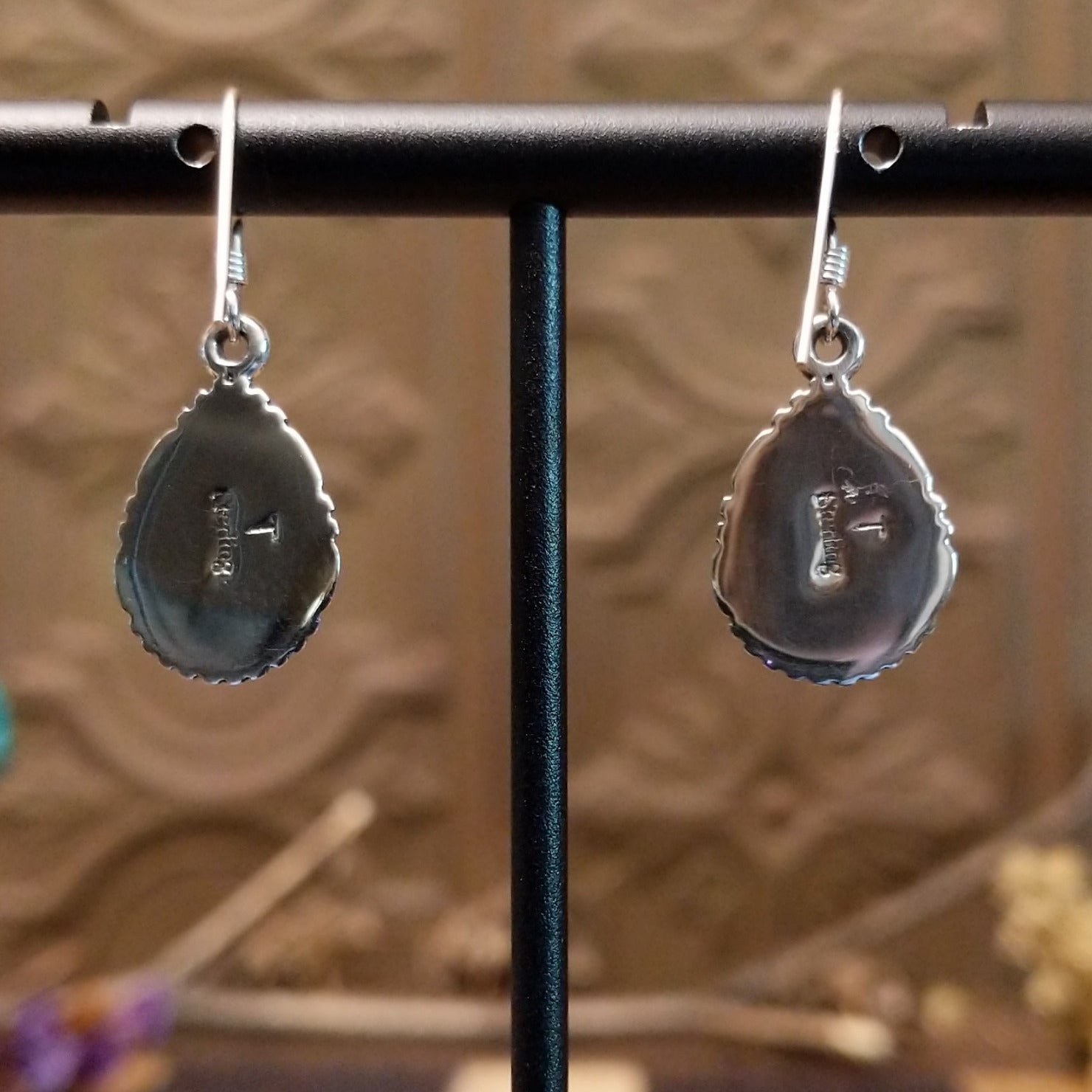 Close-up of the artisan's stamped signature.