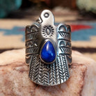 Sterling silver thunderbird ring featuring lapis in a teardrop bezel.