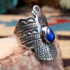 Sterling silver thunderbird ring featuring lapis in a teardrop bezel.