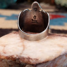 Sterling silver thunderbird ring featuring lapis in a teardrop bezel.