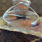 Sterling silver cuff bracelet with twisted rope and intricate silverwork.